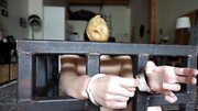 Elise Graves handcuffs herself and masturbates in a cage