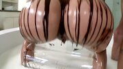 Blonde covers herself and her man in chocolate. She eats cum as well